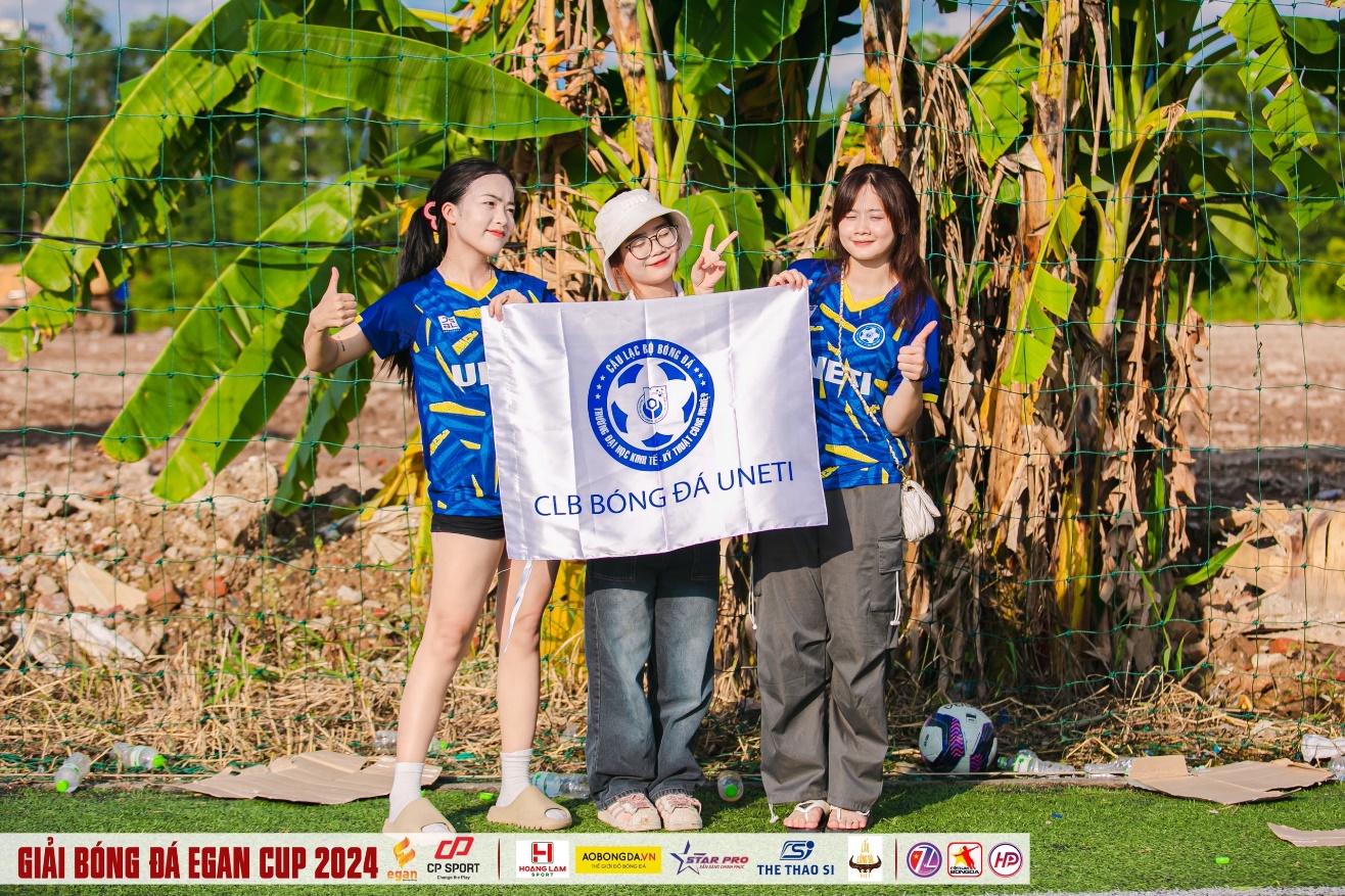 A group of women holding a flag AI-generated content may be incorrect.
