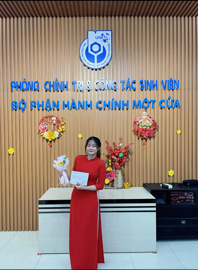 A person in a red dress holding a paper AI-generated content may be incorrect.